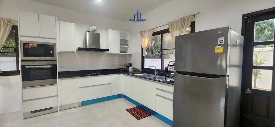 Charming 3-Bedroom Two-Story House with Spacious Porch and Lush Lawn