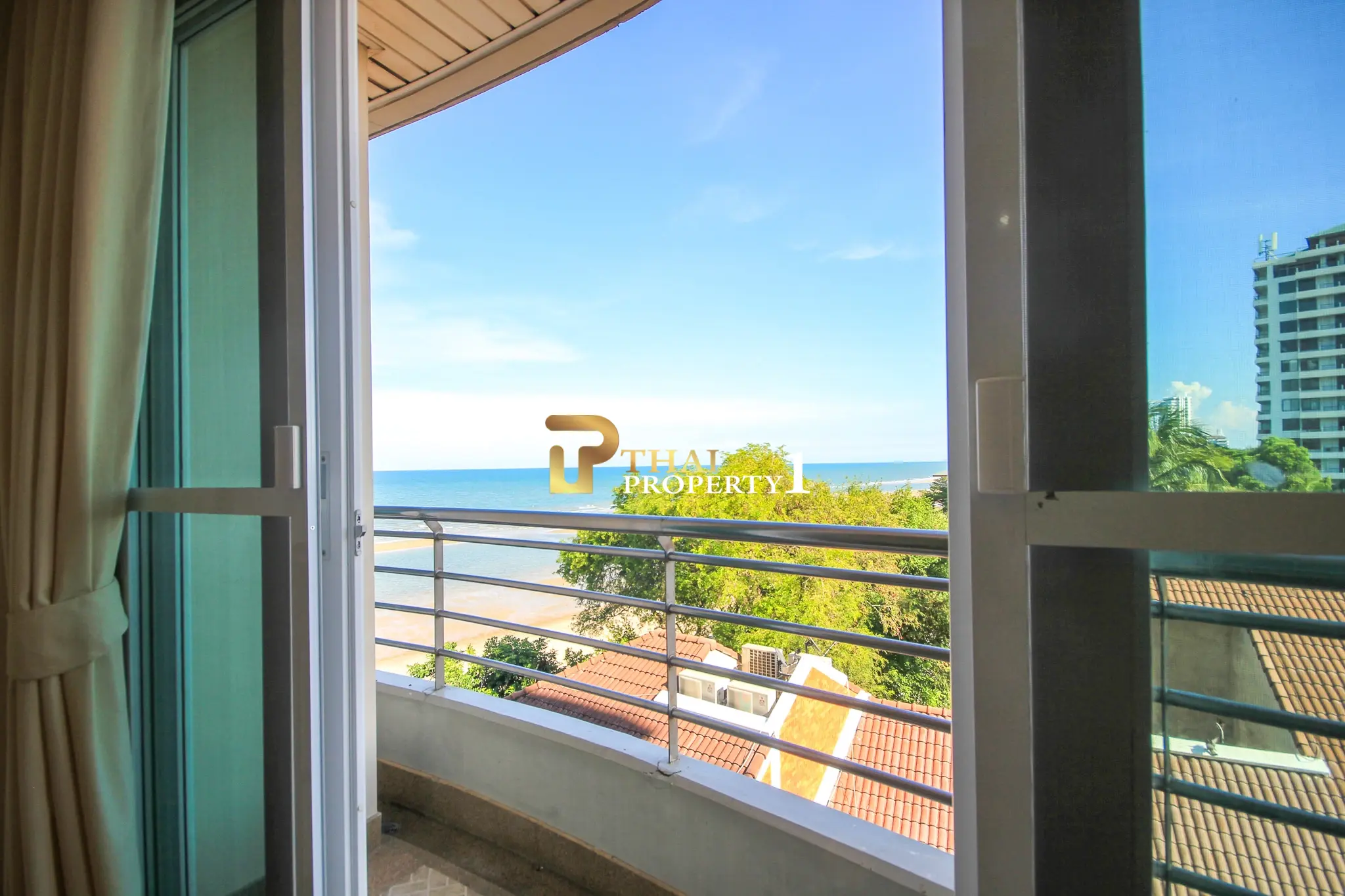Beachfront 2-Bedroom Condo with Ocean Views and Multiple Balconies at Baan Hansa Condo Cha Am