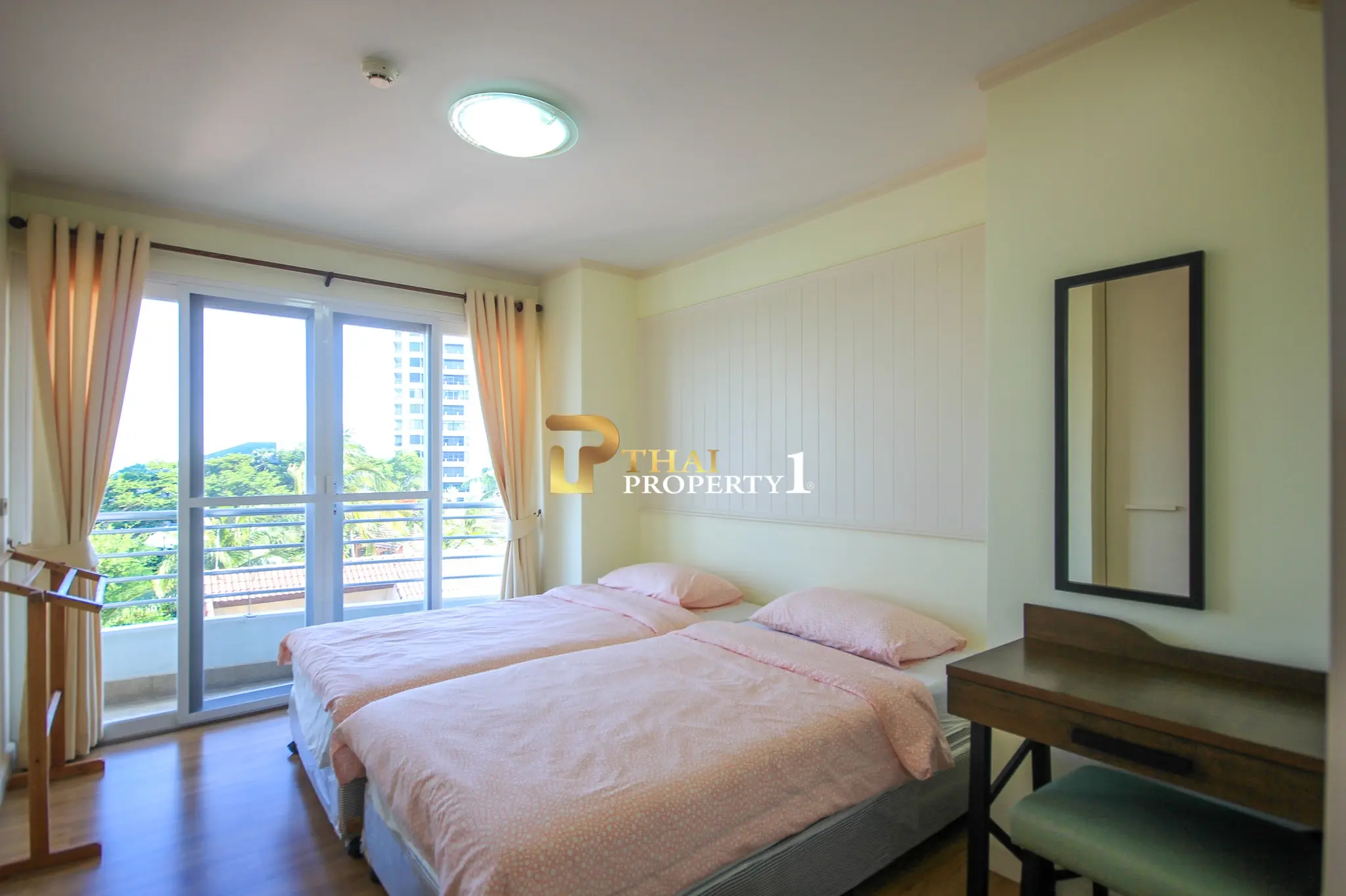 Beachfront 2-Bedroom Condo with Ocean Views and Multiple Balconies at Baan Hansa Condo Cha Am